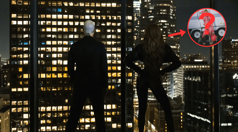 Maroon 5 and BLACKPINK Lisa collaboration teaser image showing two figures overlooking city skyline at night with a zoomed-in mystery woman in red outfit, sparking fan theories
