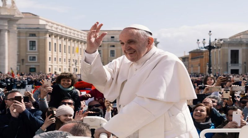 Pope Francis warmly greets a sea of faithful during a public appearance, reflecting his deep connection with the people.
