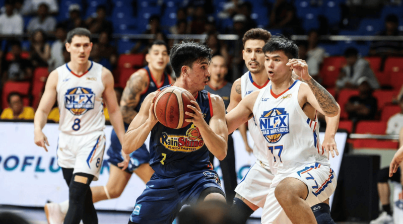 Adrian Nocum drives to the basket while being defended by NLEX players during a PBA game.